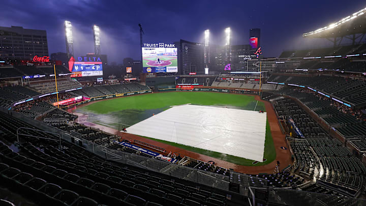 The tarp is on the field at Truist Park