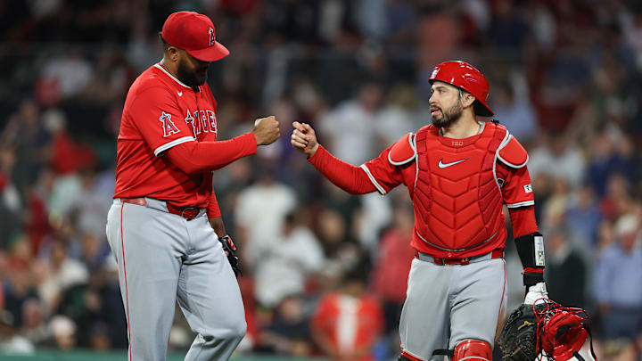 Jun 3, 2025; Boston, Massachusetts, USA; Los Angeles Angels relief pitcher Kenley Jansen (74) and Los Angeles Angels catcher Travis d'Arnaud (25) fist bump during the ninth inning against the Boston Red Sox at Fenway Park. Mandatory Credit: Paul Rutherford-Imagn Images