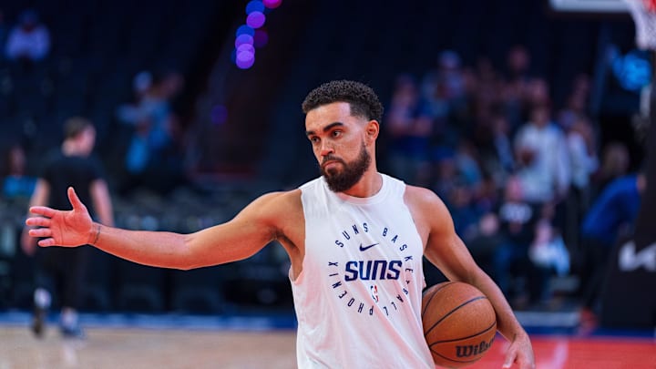 Dec 15, 2024; Phoenix, Arizona, USA; Phoenix Suns point guard Tyus Jones (21) reacts during warmups before the start of a game against the Portland Trail Blazers at Footprint Center. Mandatory Credit: Allan Henry-Imagn Images