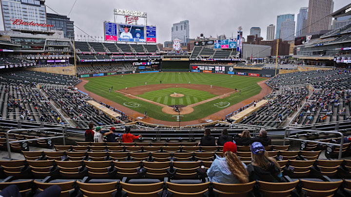 Jun 26, 2025; Minneapolis, Minnesota, USA; Sparsely seated fans watch the Seattle Mariners play the Minnesota Twins in the seventh inning after a nearly four and a half hour rain delay at Target Field. Mandatory Credit: Bruce Kluckhohn-Imagn Images