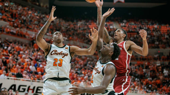 Feb 24, 2024; Stillwater, Oklahoma, USA; Oklahoma Sooners guard Milos Uzan (12) battles for a Feb 24, 2024; Stillwater, Oklahoma, USA; Oklahoma Sooners guard Milos Uzan (12) battles for a
