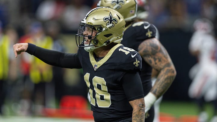Oct 13, 2024; New Orleans, Louisiana, USA;  New Orleans Saints quarterback Spencer Rattler (18) reacts to throwing a touchdown against the Tampa Bay Buccaneers during the first half at Caesars Superdome. Mandatory Credit: Stephen Lew-Imagn Images