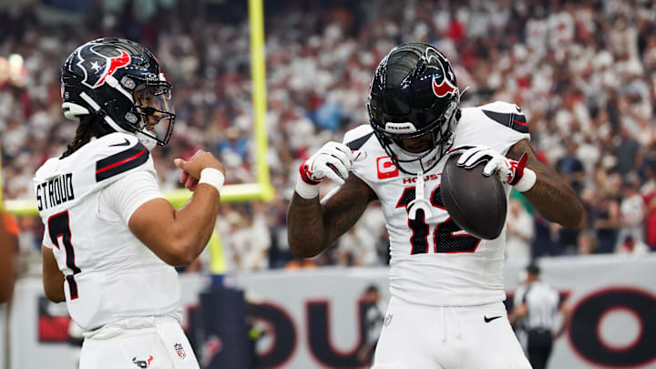 Sep 15, 2025; Houston, Texas, USA; Houston Texans wide receiver Nico Collins (12) celebrates with Houston Texans quarterback C.J. Stroud (7) after scoring a touchdown during the first quarter against the Tampa Bay Buccaneers at NRG Stadium. Mandatory Credit: Thomas Shea-Imagn Images
