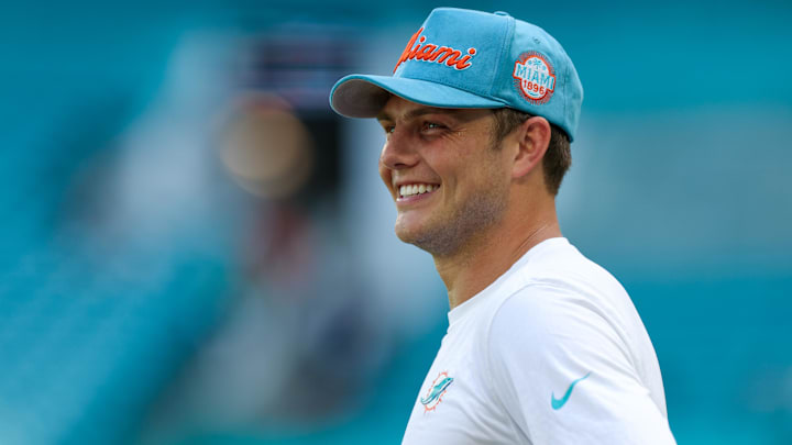 Miami Dolphins quarterback Zach Wilson (0) looks on before a game against the New England Patriots at Hard Rock Stadium.
