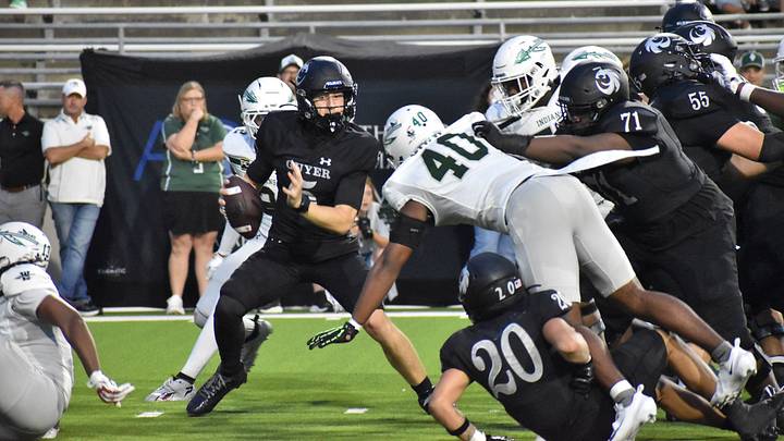 Guyer's Carter Morgan looks to evade the rush a couple of weeks ago against Waxahachie in a 44-30 loss. The Wildcats have been idle since then but return to action Thursday night at home against Wakeland. Guyer's Carter Morgan looks to evade the rush a couple of weeks ago against Waxahachie in a 44-30 loss. The Wildcats have been idle since then but return to action Thursday night at home against Wakeland.