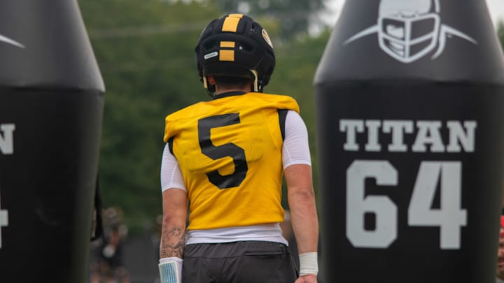 Aug 6, 2025; Columbia, MO, USA; Missouri Tigers freshman quarterback Matt Zollers (5) walks back for a drill during Missouri fall camp at Mizzou Athletic Training Complex. Aug 6, 2025; Columbia, MO, USA; Missouri Tigers freshman quarterback Matt Zollers (5) walks back for a drill during Missouri fall camp at Mizzou Athletic Training Complex.