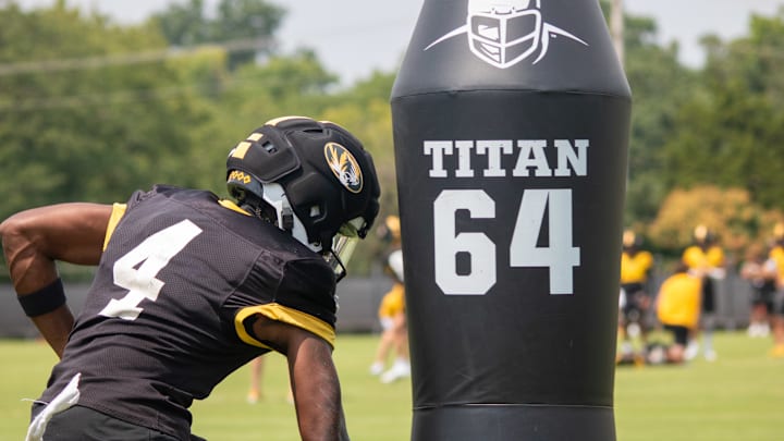 Aug 6, 2025; Columbia, MO, USA; Missouri Tigers wide receiver James Madison II (4) runs past a dummy at a Missouri fall camp practice at Mizzou Athletic Training Complex. Aug 6, 2025; Columbia, MO, USA; Missouri Tigers wide receiver James Madison II (4) runs past a dummy at a Missouri fall camp practice at Mizzou Athletic Training Complex.