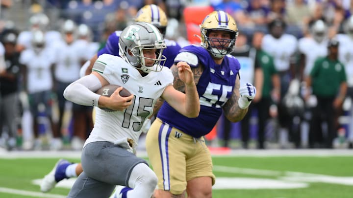 Sep 7, 2024; Seattle, Washington, USA; Eastern Michigan Eagles quarterback Cole Snyder (15) carries the ball against the Washington Huskies during the second half at Alaska Airlines Field at Husky Stadium. Mandatory Credit: Steven Bisig-Imagn Images