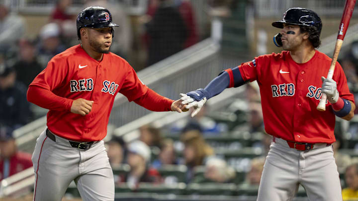 Apr 13, 2026; Minneapolis, Minnesota, USA; Boston Red Sox first baseman Willson Contreras (40) shakes hands with second baseman Marcelo Mayer (11) after scoring a run against the Minnesota Twins in the sixth inning at Target Field. Mandatory Credit: Jesse Johnson-Imagn Images