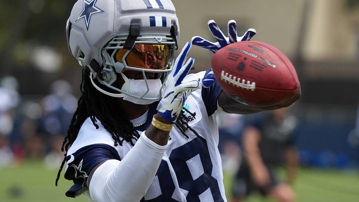Jul 29, 2026; Oxnard, CA, USA; Dallas Cowboys receiver CeeDee Lamb (88) catches the ball wearing a Guardian helmet cap at training camp at River Ridge Playing Fields. Mandatory Credit: Kirby Lee-Imagn Images Jul 29, 2026; Oxnard, CA, USA; Dallas Cowboys receiver CeeDee Lamb (88) catches the ball wearing a Guardian helmet cap at training camp at River Ridge Playing Fields. Mandatory Credit: Kirby Lee-Imagn Images