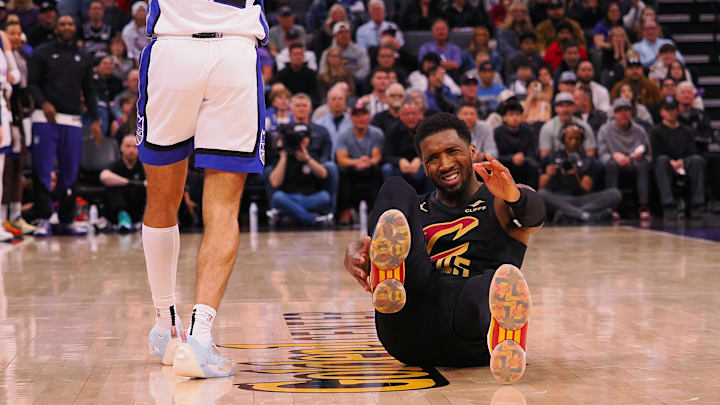 Mar 19, 2025; Sacramento, California, USA; Cleveland Cavaliers guard Donovan Mitchell (45) on the floor after being fouled by Sacramento Kings guard Devin Carter (22) during the fourth quarter at Golden 1 Center. Mandatory Credit: Kelley L Cox-Imagn Images