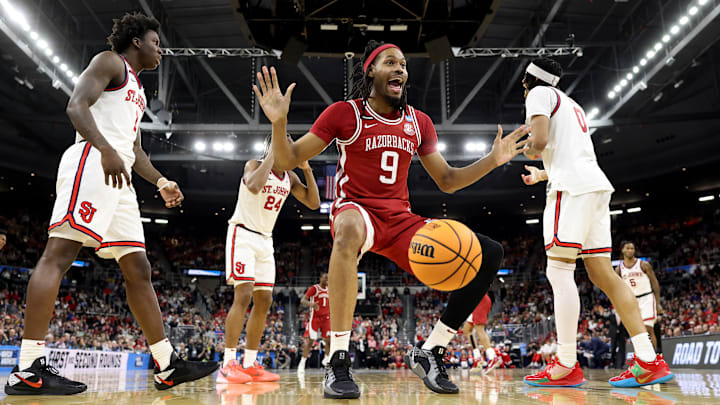 Arkansas Razorback senior center Jonas Aidoo celebrates after a dunk during Saturday's second round win over St. John's in the 2025 NCAA Men's Basketball Western Region in Providence, R.I. 