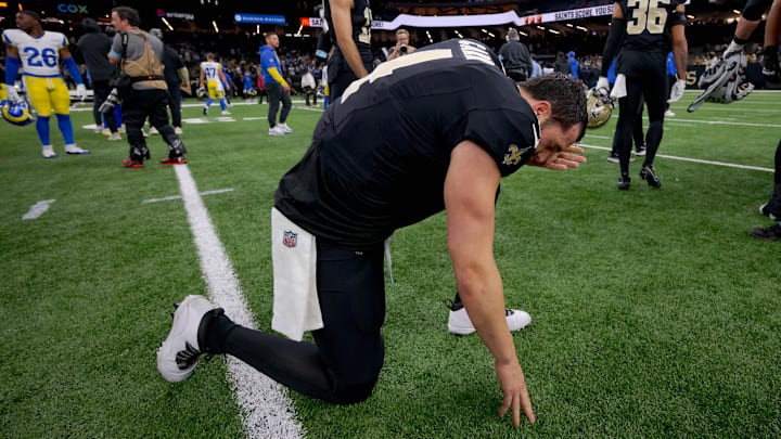 Dec 1, 2024; New Orleans, Louisiana, USA; New Orleans Saints quarterback Derek Carr (4) kneels at the end of the game against the Los Angeles Rams at Caesars Superdome. Mandatory Credit: Matthew Hinton-Imagn Images Dec 1, 2024; New Orleans, Louisiana, USA; New Orleans Saints quarterback Derek Carr (4) kneels at the end of the game against the Los Angeles Rams at Caesars Superdome. Mandatory Credit: Matthew Hinton-Imagn Images