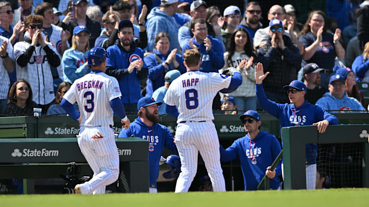 May 3, 2026; Chicago, Illinois, USA; Chicago Cubs left fielder Ian Happ (8) and third baseman Alex Bregman (3) celebrate with teammates after scoring against the Arizona Diamondbacks during the fifth inning at Wrigley Field. Mandatory Credit: Patrick Gorski-Imagn Images