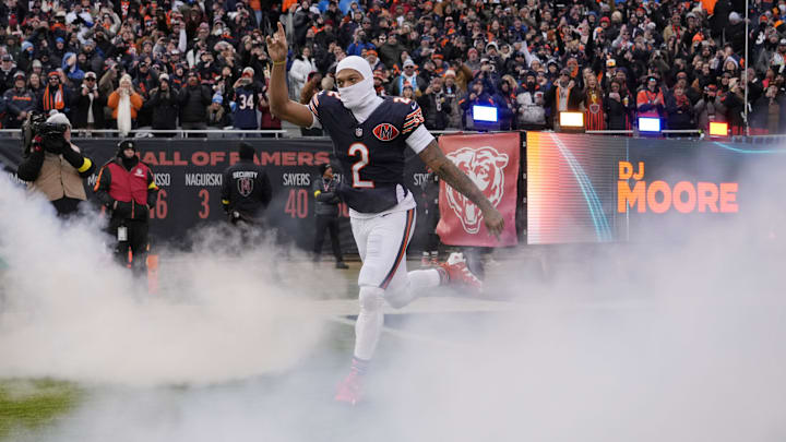Jan 4, 2026; Chicago, Illinois, USA; Chicago Bears wide receiver DJ Moore (2) runs onto the field before the game between the Chicago Bears and the Detroit Lions at Soldier Field. Mandatory Credit: David Banks-Imagn Images