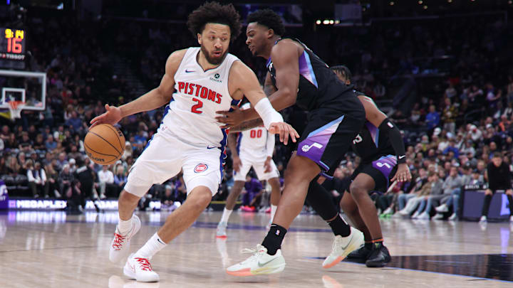 Mar 3, 2025; Salt Lake City, Utah, USA; Detroit Pistons guard Cade Cunningham (2) drives against Utah Jazz forward Brice Sensabaugh (28) during the first half at Delta Center. Mandatory Credit: Rob Gray-Imagn Images