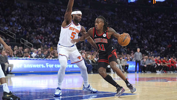 Feb 20, 2025; New York, New York, USA;  Chicago Bulls shooting guard Ayo Dosunmu (11) dribbles the ball