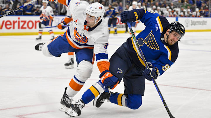 Oct 17, 2024; St. Louis, Missouri, USA;  New York Islanders defenseman Adam Pelech (3) checks St. Louis Blues left wing Pavel Buchnevich (89) during the second period at Enterprise Center. Mandatory Credit: Jeff Curry-Imagn Images