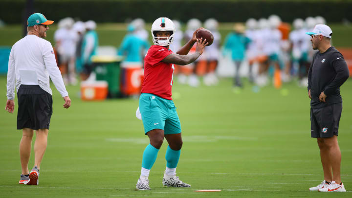Jul 24, 2024; Miami Gardens, FL, USA; Miami Dolphins quarterback Tua Tagovailoa (1) throws the football at Baptist Health Training Complex during training camp. Jul 24, 2024; Miami Gardens, FL, USA; Miami Dolphins quarterback Tua Tagovailoa (1) throws the football at Baptist Health Training Complex during training camp.
