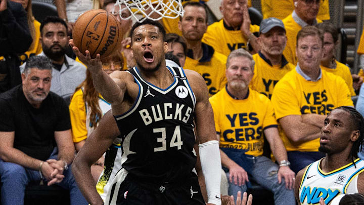 Apr 29, 2025; Indianapolis, Indiana, USA; Milwaukee Bucks forward Giannis Antetokounmpo (34) shoots the ball while  Indiana Pacers guard Andrew Nembhard (2) defends during game five of the first round for the 2024 NBA Playoffs at Gainbridge Fieldhouse. Mandatory Credit: Trevor Ruszkowski-Imagn Images