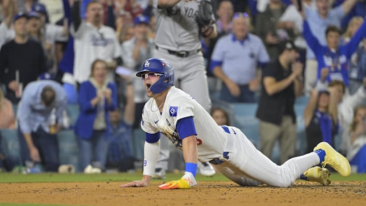 Oct 25, 2024; Los Angeles, California, USA; Los Angeles Dodgers third baseman Enrique Hernandez (8) slides into home plate to score a run in the fifth inning against the New York Yankees during game one of the 2024 MLB World Series at Dodger Stadium. Mandatory Credit: Jayne Kamin-Oncea-Imagn Images Oct 25, 2024; Los Angeles, California, USA; Los Angeles Dodgers third baseman Enrique Hernandez (8) slides into home plate to score a run in the fifth inning against the New York Yankees during game one of the 2024 MLB World Series at Dodger Stadium. Mandatory Credit: Jayne Kamin-Oncea-Imagn Images