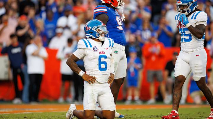 Sep 26, 2026; Gainesville, Florida, USA;  Mississippi Rebels quarterback Trinidad Chambliss (6) winces from the ground while Florida Gators defensive lineman Jeramiah McCloud (91) makes a gesture during the second half at Ben Hill Griffin Stadium.  Mandatory Credit: Matt Pendleton-Imagn Images