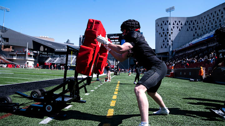 Cincinnati Bearcats linebacker Jake Golday (11) hits a pad during the Cincinnati Bearcats football spring practice at Nippert Stadium on Saturday, April 12, 2025. Cincinnati Bearcats linebacker Jake Golday (11) hits a pad during the Cincinnati Bearcats football spring practice at Nippert Stadium on Saturday, April 12, 2025.