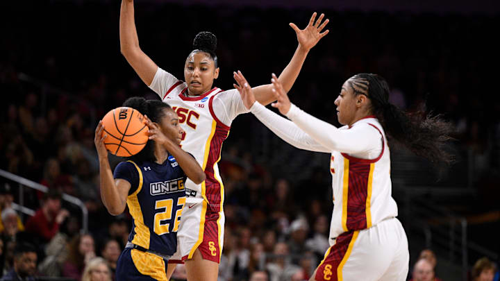 Watkins (center) and the Trojans held UNC-Greensboro to just 25 points on Saturday. Watkins (center) and the Trojans held UNC-Greensboro to just 25 points on Saturday.