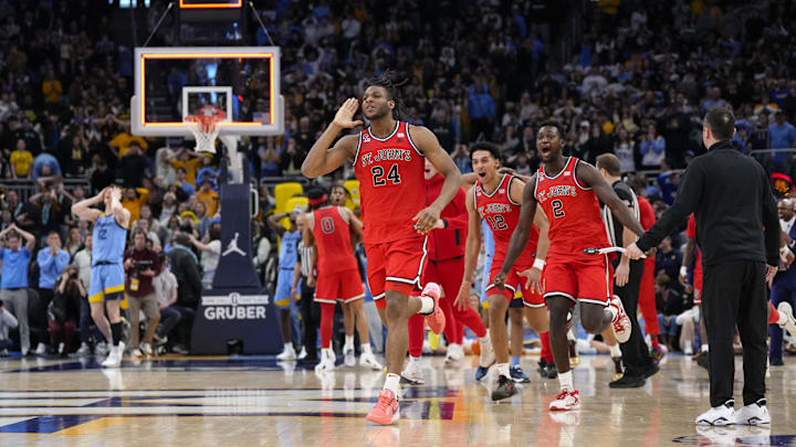 St. John's forward Zuby Ejiofor celebrates after making the game winning shot in overtime against Marquette.