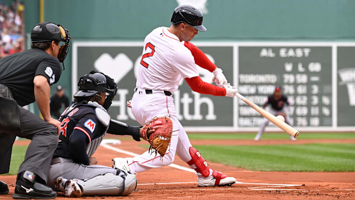 Sep 1, 2025; Boston, Massachusetts, USA; Boston Red Sox third baseman Alex Bregman (2) hits a double during the first inning against the Cleveland Guardians at Fenway Park. Mandatory Credit: Eric Canha-Imagn Images
