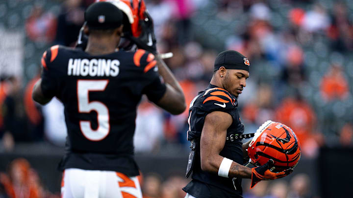 Cincinnati Bengals wide receiver Ja'Marr Chase (1) and Cincinnati Bengals wide receiver Tee Higgins (5) prepare to warm up before the NFL game between the Cincinnati Bengals and the Denver Broncos at Paycor Stadium in Cincinnati on Saturday, Dec. 28, 2024.