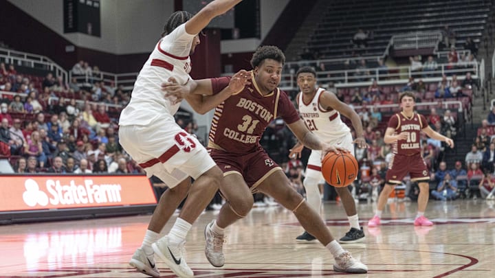 Feb 26, 2025; Stanford, California, USA;  Boston College Eagles forward Elijah Strong (31) controls the ball during the second half against Stanford Cardinal forward Donavin Young (2) at Maples Pavilion. Mandatory Credit: Stan Szeto-Imagn Images