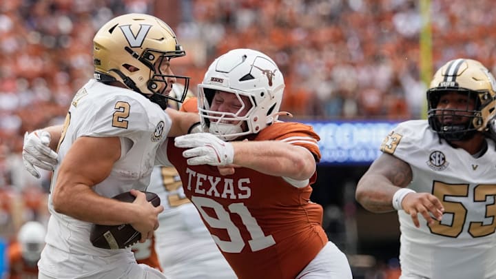 Texas Longhorns defensive lineman Ethan Burke (91) sacks Vanderbilt Commodores quarterback Diego Pavia (2) on the one yard line during the second half at Darrell K Royal-Texas Memorial Stadium. 