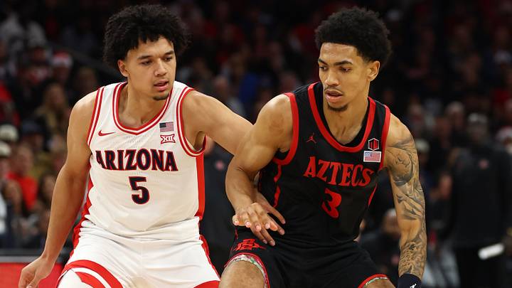 Dec 20, 2025; Phoenix, Arizona, USA; Arizona Wildcats guard Brayden Burries (5) defends against San Diego State Aztecs guard Elzie Harrington (3) during the Hall of Fame Series at Mortgage Matchup Center. Dec 20, 2025; Phoenix, Arizona, USA; Arizona Wildcats guard Brayden Burries (5) defends against San Diego State Aztecs guard Elzie Harrington (3) during the Hall of Fame Series at Mortgage Matchup Center.