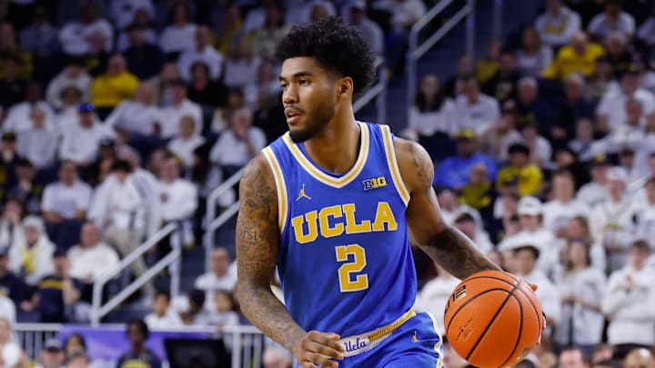 Feb 14, 2026; Ann Arbor, Michigan, USA;  UCLA Bruins guard Donovan Dent (2) dribbles against the Michigan Wolverines at Crisler Center. Mandatory Credit: Rick Osentoski-Imagn Images
