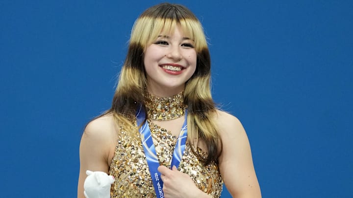 Feb 19, 2026; Milan, Italy; Alysa Liu of the United States celebrates with the gold medal during the medal ceremony for the women's free skate during the Milano Cortina 2026 Olympic Winter Games at Milano Ice Skating Arena.