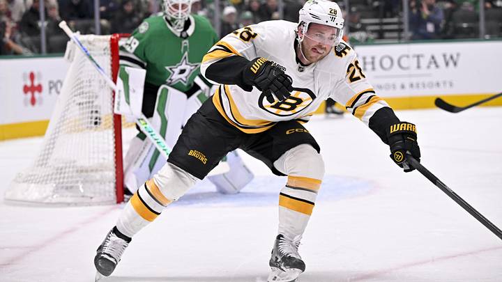 Jan 20, 2026; Dallas, Texas, USA;  Boston Bruins center Elias Lindholm (28) chases the puck in the Dallas Stars zone during the first period at the American Airlines Center. Mandatory Credit: Jerome Miron-Imagn Images