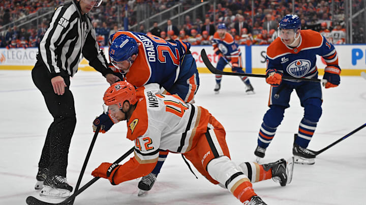 Apr 20, 2026; Edmonton, Alberta, CAN;  Edmonton Oilers center Leon Draisaitl (29) and Anaheim Ducks center Tim Washe (42) battle for the puck in game one of the first round of the 2026 Stanley Cup Playoffs during the third period at Rogers Place. Mandatory Credit: Walter Tychnowicz-Imagn Images