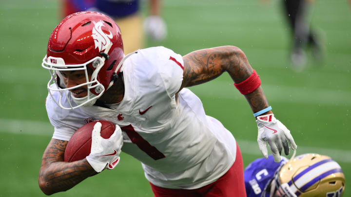 Sep 14, 2024; Seattle, Washington, USA; Washington State Cougars wide receiver Kris Hutson (1) carries the ball after making a catch against the Washington Huskies during the second half at Lumen Field. Mandatory Credit: Steven Bisig-Imagn Images Sep 14, 2024; Seattle, Washington, USA; Washington State Cougars wide receiver Kris Hutson (1) carries the ball after making a catch against the Washington Huskies during the second half at Lumen Field. Mandatory Credit: Steven Bisig-Imagn Images