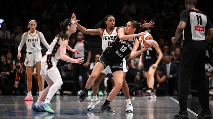 Aug 22, 2026; Brooklyn, New York, USA; New York Liberty guard Pauline Astier (18) looks to pass the ball as Indiana Fever guard Kelsey Mitchell (0) and Caitlin Clark (22) defend during the second half at Barclays Center. Mandatory Credit: John Jones-Imagn Images Aug 22, 2026; Brooklyn, New York, USA; New York Liberty guard Pauline Astier (18) looks to pass the ball as Indiana Fever guard Kelsey Mitchell (0) and Caitlin Clark (22) defend during the second half at Barclays Center. Mandatory Credit: John Jones-Imagn Images