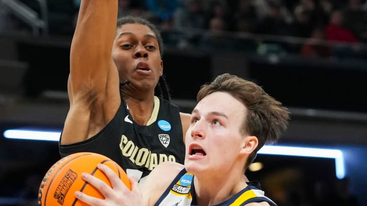 Marquette Golden Eagles guard Tyler Kolek (11) drives the lane as Colorado Buffaloes forward Cody Williams (10) defends, Sunday, March 24, 2024, during the second round of the NCAA Men’s Basketball Tournament at Gainbridge Fieldhouse in Indianapolis. The Marquette Golden Eagles defeated the Colorado Buffaloes 81-77. Marquette Golden Eagles guard Tyler Kolek (11) drives the lane as Colorado Buffaloes forward Cody Williams (10) defends, Sunday, March 24, 2024, during the second round of the NCAA Men’s Basketball Tournament at Gainbridge Fieldhouse in Indianapolis. The Marquette Golden Eagles defeated the Colorado Buffaloes 81-77.
