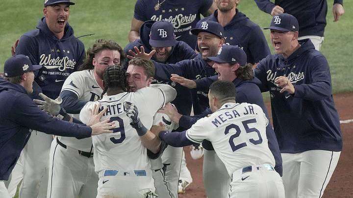 Tampa Bay Rays second baseman Ben Williamson (15) celebrates with teammates including Tampa Bay Rays shortstop Jorge Mateo (9) after he hit the game winning walk off RBI single off of Milwaukee Brewers pitcher Shane Drohan (55) during the twelfth inning during Game 4 of the Brewers 4-3 World Series loss at Tropicana Field in St. Petersburg, Fla. on Oct 27, 2026.
