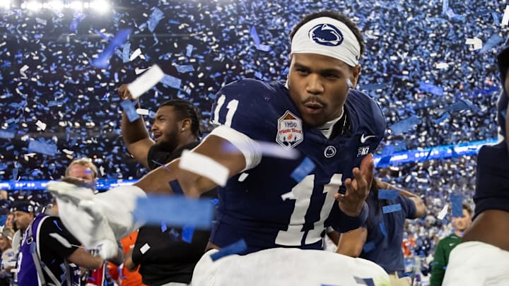 Dec 31, 2024; Glendale, AZ, USA; Penn State Nittany Lions defensive end Abdul Carter (11) celebrates with the Heisman pose after defeating the Boise State Broncos in the Fiesta Bowl at State Farm Stadium. Mandatory Credit: Mark J. Rebilas-Imagn Images