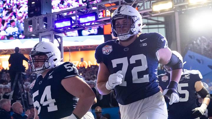 Dec 31, 2024; Glendale, AZ, USA; Penn State Nittany Lions offensive lineman Nolan Rucci (72) and Ian Harvie (54) against the Boise State Broncos during the Fiesta Bowl at State Farm Stadium. Mandatory Credit: Mark J. Rebilas-Imagn Images