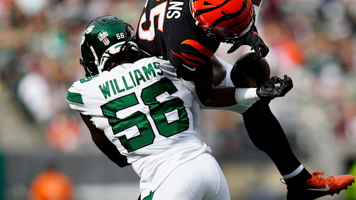 New York Jets linebacker Quincy Williams (56) catches Cincinnati Bengals running back Chris Evans (25) mid-air on a catch in the third quarter of the NFL Week 3 game between the New York Jets and the Cincinnati Bengals at MetLife Stadium in East Rutherford, N.J., on Sunday, Sept. 25, 2022. The Bengals improved to 1-2 on the season with a 27-12 win over the Jets.

Cincinnati Bengals At New York Jets Week 3