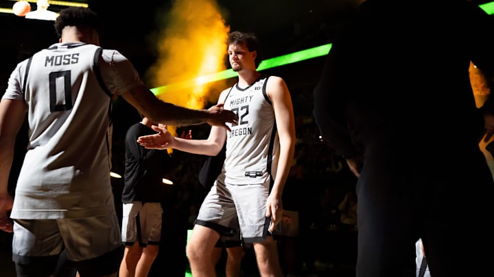 Oregon center Nate Bittle, right, takes the court and greets Oregon guard Ra'Heim Moss as the Oregon Ducks host the Northwestern Wildcats on Tuesday, Feb. 11, 2025, at Matthew Knight Arena.