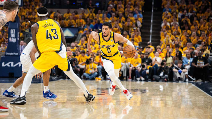 May 17, 2024; Indianapolis, Indiana, USA; Indiana Pacers guard Tyrese Haliburton (0) dribbles  the ball during game six of the second round for the 2024 NBA playoffs against the New York Knicks at Gainbridge Fieldhouse. Mandatory Credit: Trevor Ruszkowski-Imagn Images