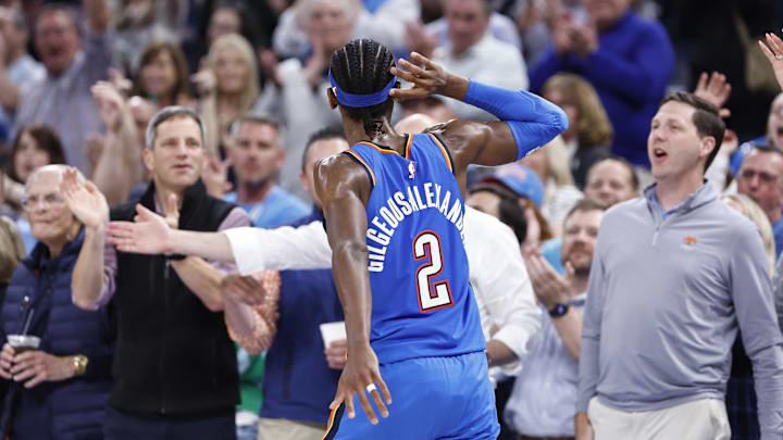 Apr 9, 2024; Oklahoma City, Oklahoma, USA; Oklahoma City Thunder guard Shai Gilgeous-Alexander (2) listens to the fans cheer after he scores against the Sacramento Kings during the second half at Paycom Center. Mandatory Credit: Alonzo Adams-Imagn Images