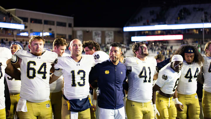 Nov 1, 2025; Chestnut Hill, Massachusetts, USA; Notre Dame Fighting Irish head coach Marcus Freeman, offensive lineman Joe Otting (64), safety Adon Shuler (8), defensive lineman Junior Tuihalamaka (44), quarterback CJ Carr (13) and defensive lineman Donovan Hinish (41) after the game against the Boston College Eagles at Alumni Stadium. Mandatory Credit: Edward Finan-Imagn Images Nov 1, 2025; Chestnut Hill, Massachusetts, USA; Notre Dame Fighting Irish head coach Marcus Freeman, offensive lineman Joe Otting (64), safety Adon Shuler (8), defensive lineman Junior Tuihalamaka (44), quarterback CJ Carr (13) and defensive lineman Donovan Hinish (41) after the game against the Boston College Eagles at Alumni Stadium. Mandatory Credit: Edward Finan-Imagn Images