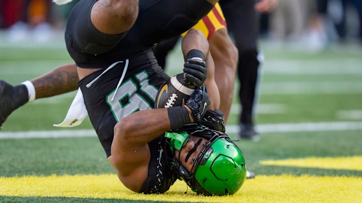 Duck fans would go head over heels if Kenyon Sadiq won the programs first-ever John Mackey Award. Duck fans would go head over heels if Kenyon Sadiq won the programs first-ever John Mackey Award.